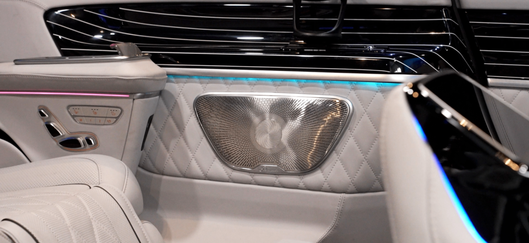 Land Jet door panel with quilted leather, speaker grille and ambient lighting