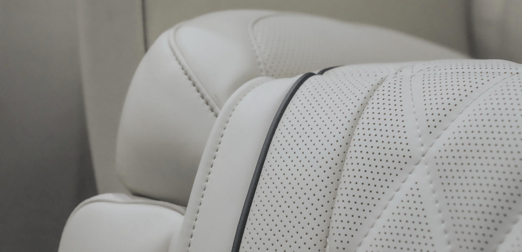 Close-up of Land Jet perforated leather seat detailing